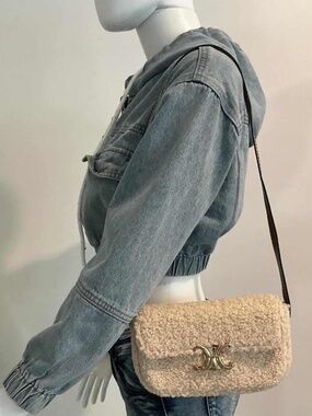 White Faux Shearling Crossbody Bag with Gold Accent and brown adjustable strap.